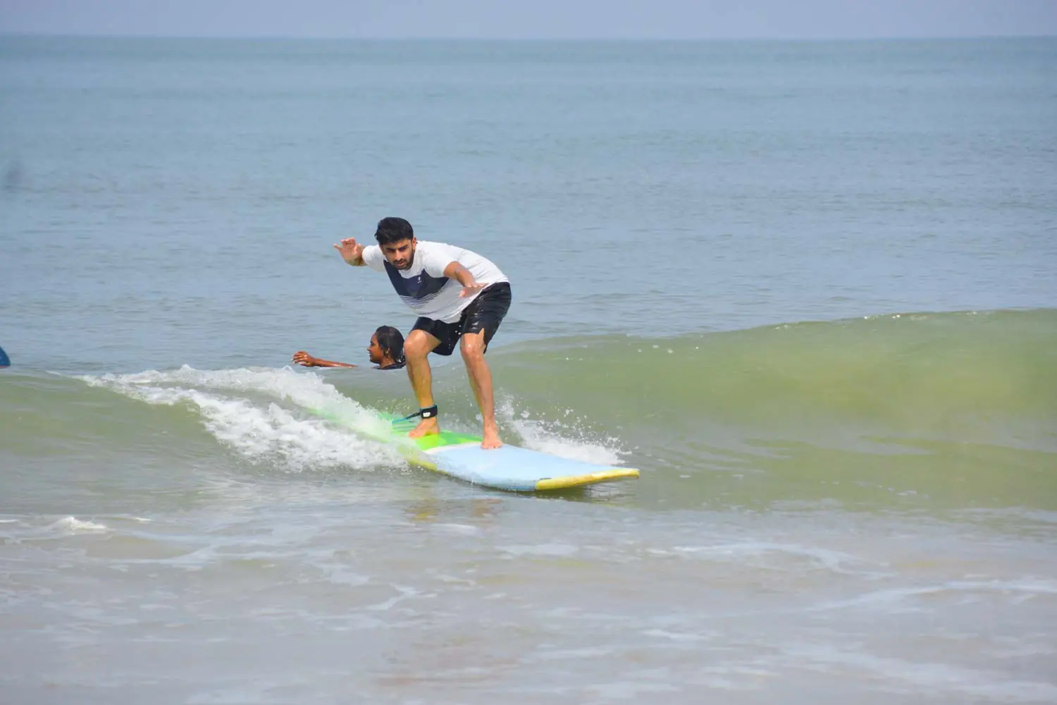 First-time surfer trying surfing with Makai Surf Adventure in Goa
