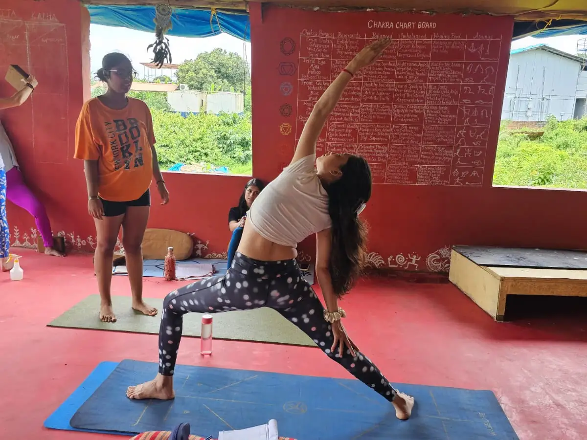 Jyothi demonstrating a yoga posture during a Vinyasa practice